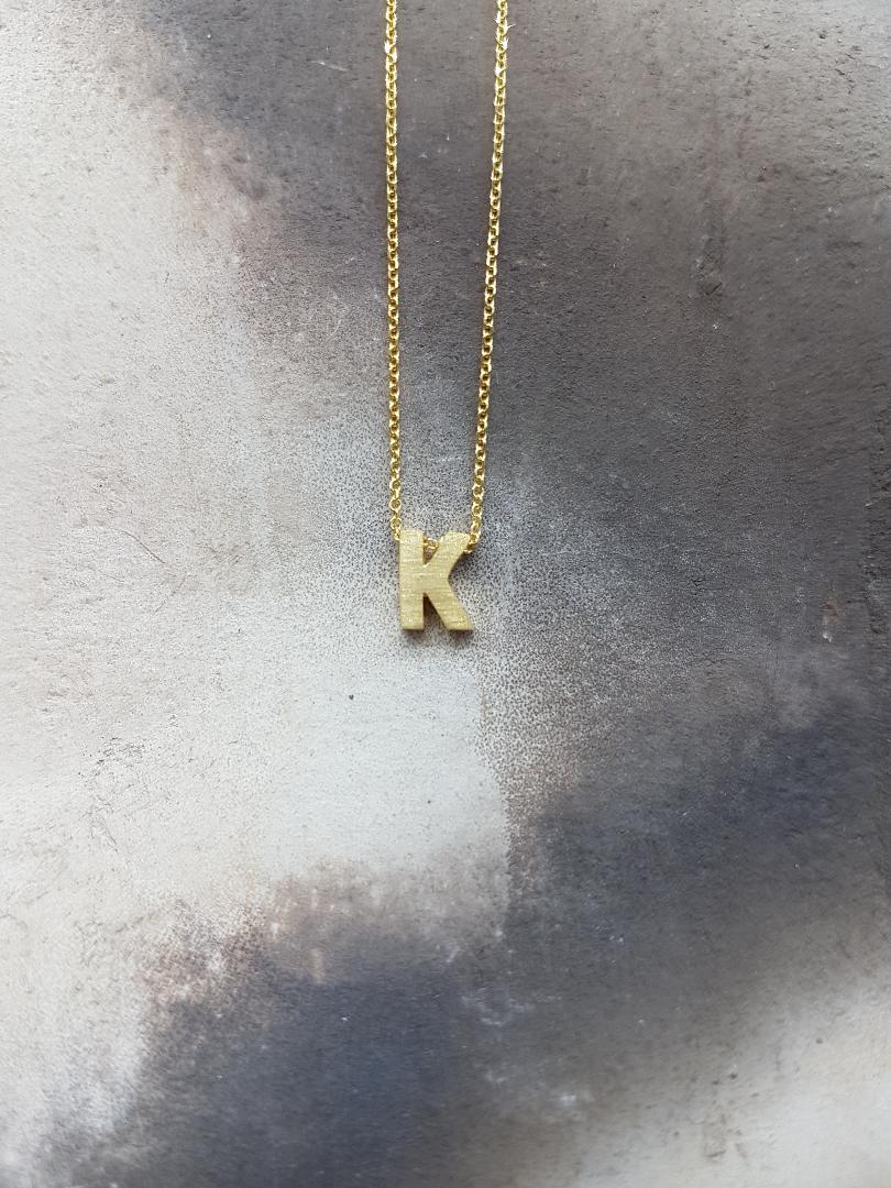 Handmade monogram from K9 gold
