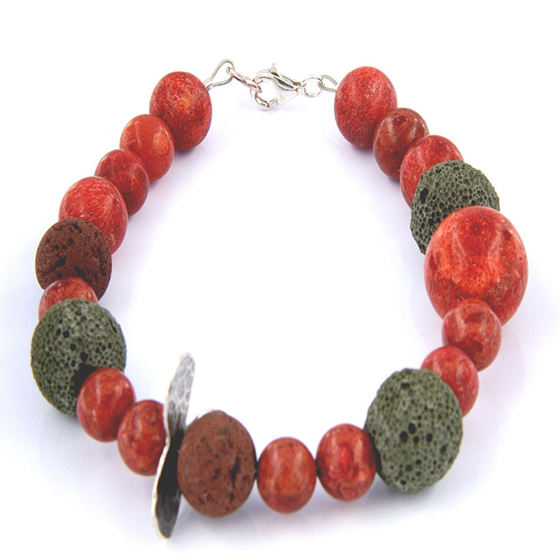 Handmade sterling silver bracelet made of 925 ° silver with lava and of course apple coral.