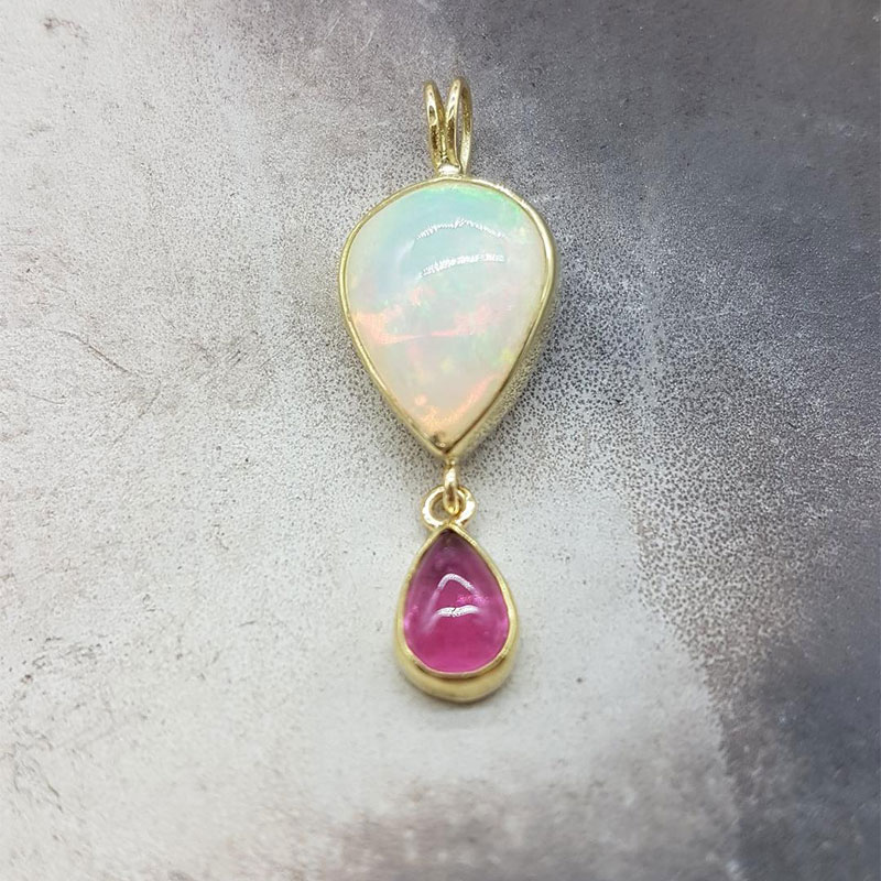 Womens handmade pendant made of K18 gold with natural Ethiopian Opal and natural Tourmaline.
