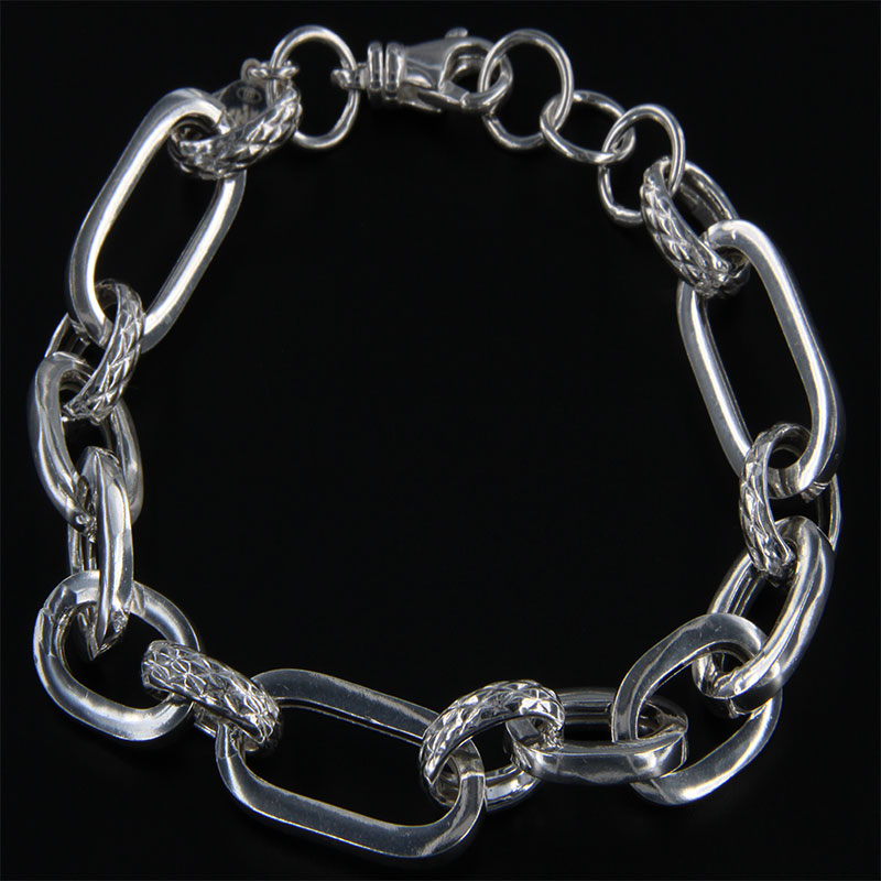 Womens 925 ° silver bracelet with oval rings consisting of polished and forged with safety clasp.
