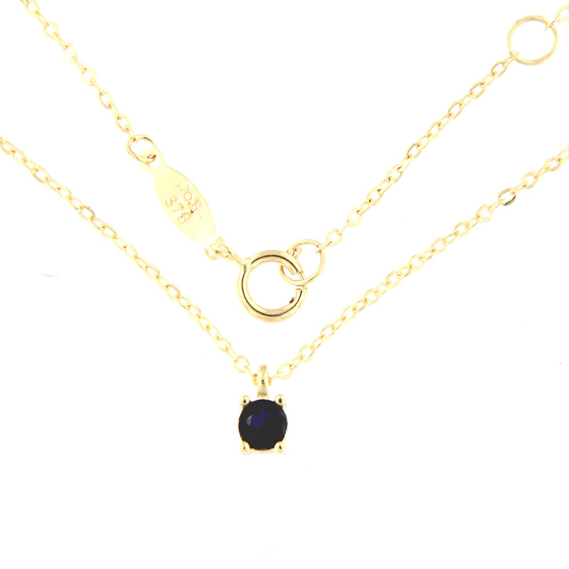 Womens gold single stone necklace with K9 chain decorated with blue natural Spinel.