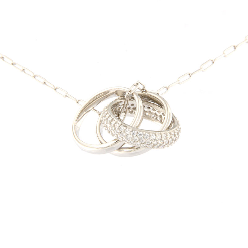 Womens silver necklace with three wedding rings and 925 chain decorated with white zircons.