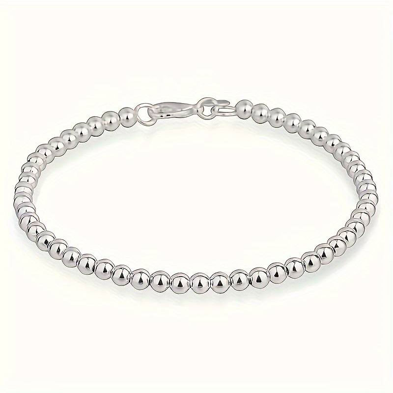 Womens silver bracelet 925° with 6mm marbles and safety clasp.