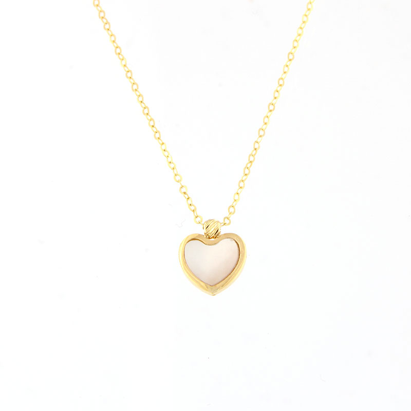 Womens 14 karat gold Heart pendant decorated with mother of pearl.